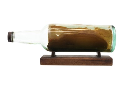 Lot 262 - A model ship in a bottle.