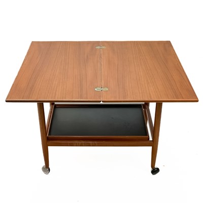 Lot 1 - A mid century teak swivel fold over trolley by Arrebo Møblor.