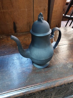 Lot 15 - A late 18th century Wedgwood Black Basalt coffee pot and cover.