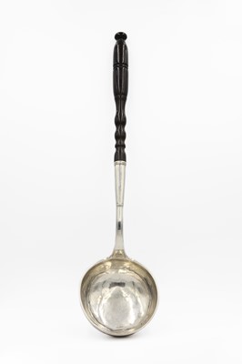 Lot 53 - An 18th-century continental silver ladle with turned wood handle.