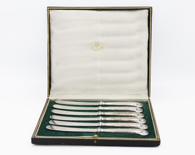 Lot 63 - A cased set of six George V silver pistol handled knives by John Sanderson.