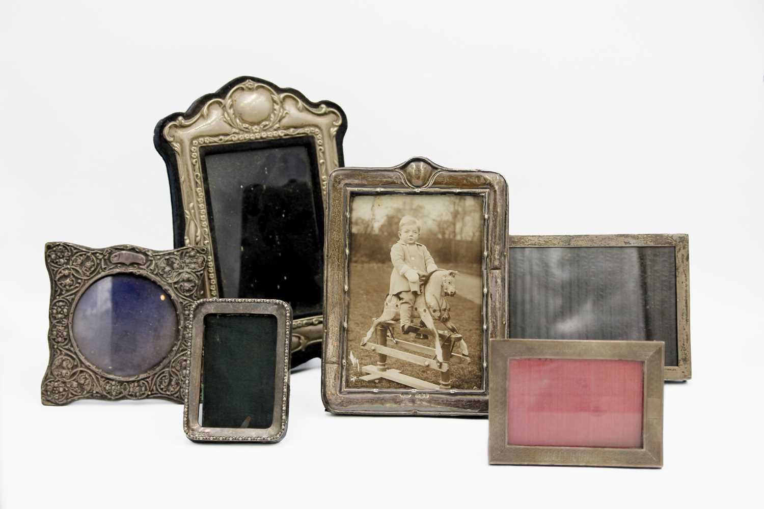 Lot 71 - A collection of five silver photo frames.