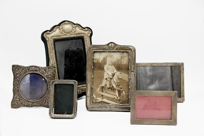 Lot 71 - A collection of five silver photo frames.