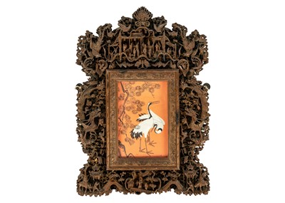Lot 124 - A Chinese carved wood photo frame, early 20th century.