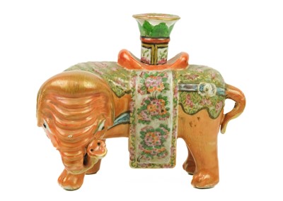 Lot 125 - A Chinese Canton famille rose 'elephant' candlestick, Qing Dynasty, 19th century.