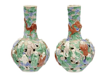 Lot 133 - A pair of Chinese famille verte reticulated bottle vases, Qing Dynasty, 19th century.
