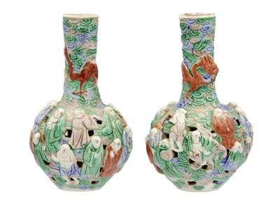 Lot 1060 - A pair of Chinese famille verte reticulated bottle vases, Qing Dynasty, 19th century.