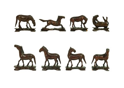 Lot 139 - Eight Chinese carved wood models of horses, early 20th century.