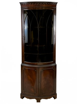 Lot 108 - A George III style mahogany floor standing corner cabinet.