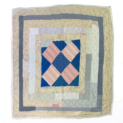 Lot 188 - A 20th century patchwork quilt.