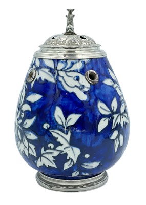 Lot 75 - A Persian pottery and silver mounted pot, early 20th century.