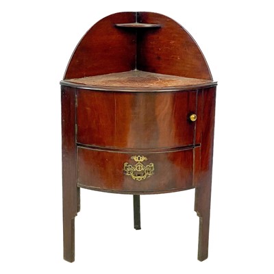 Lot 100 - A George III mahogany corner washstand.