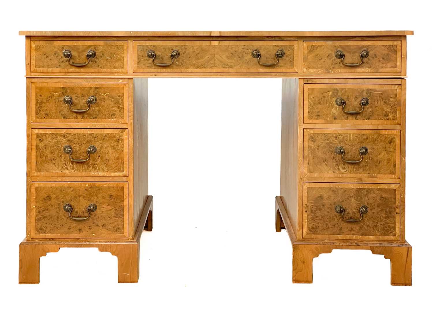 Lot 105 - A 20th century figured yew pedestal desk by Abbey Reproductions, Penzance.