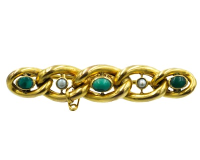 Lot 6 - An Edwardian 9ct seed pearl and turquoise set curb chain brooch.