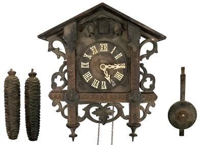 Lot 369 - A Black Forest oak and inlaid cuckoo clock.