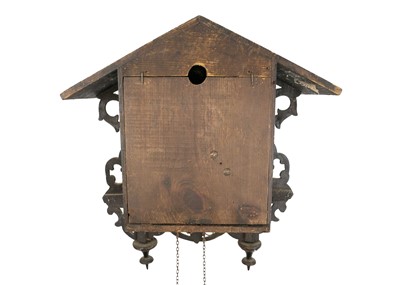 Lot 369 - A Black Forest oak and inlaid cuckoo clock.