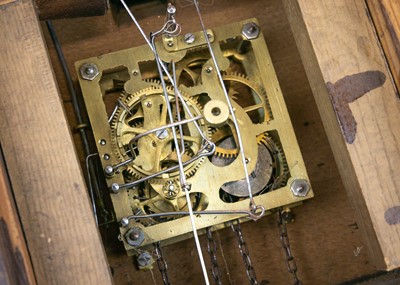 Lot 369 - A Black Forest oak and inlaid cuckoo clock.