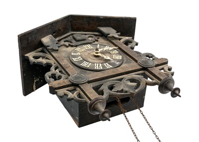 Lot 369 - A Black Forest oak and inlaid cuckoo clock.