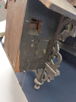 Lot 369 - A Black Forest oak and inlaid cuckoo clock.