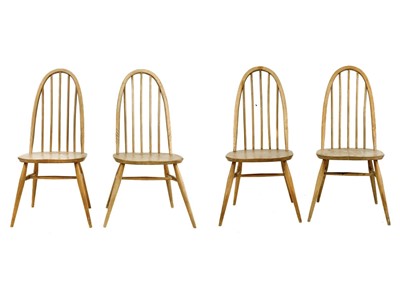 Lot 51 - Four light oak hoop back Ercol chairs