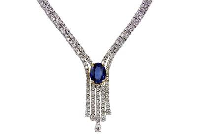 Lot 124 - Aris: An elegant diamond and sapphire necklace and bracelet suite.