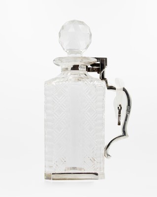 Lot 42 - An Edwardian Betjemann's patent silver mounted cut glass locking decanter.