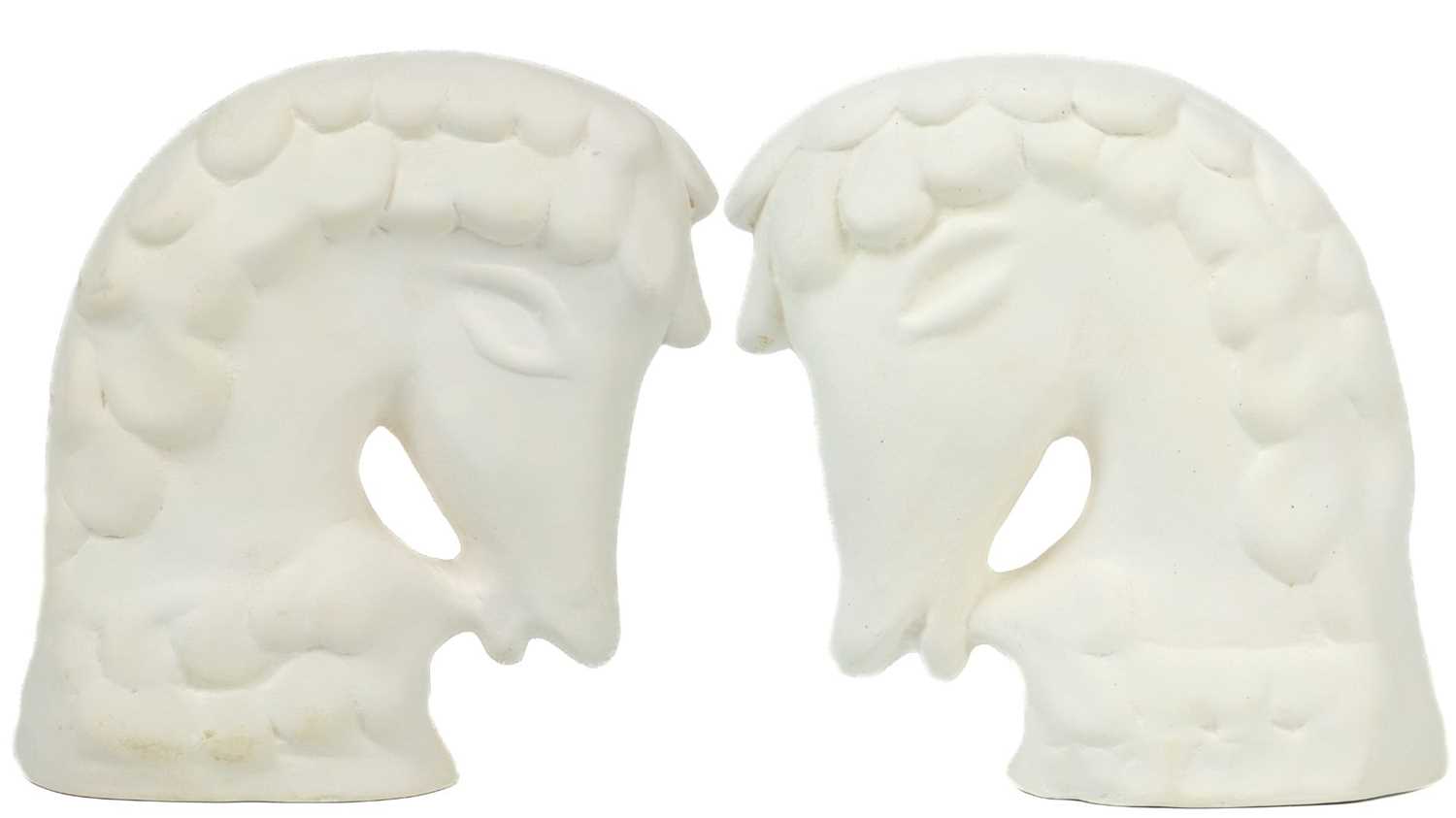 Lot 55 - A pair of biscuit pottery horse heads probably by Eric Leaper.