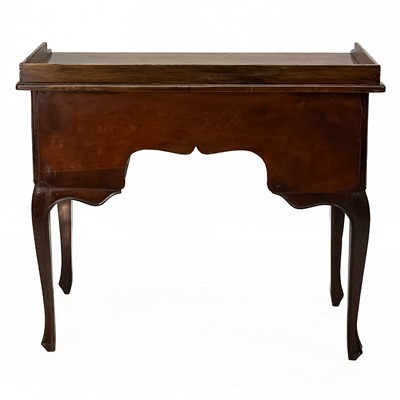 Lot 294 - A French provincial walnut tray top dressing table or lowboy.