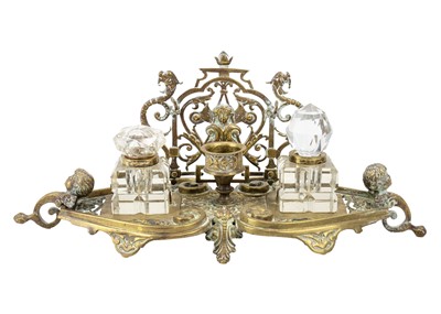 Lot 293 - An ornate Victorian brass inkstand.