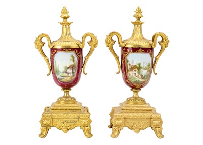 Lot 379 - A French gilt spelter clock garniture.