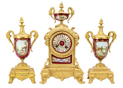 Lot 379 - A French gilt spelter clock garniture.
