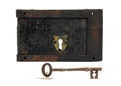 Lot 204 - A Victorian lock and key on oak.