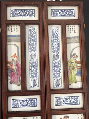 Lot 20 - A Chinese porcelain and hardwood eight paneled screen, Qing Dynasty, early 20th century.