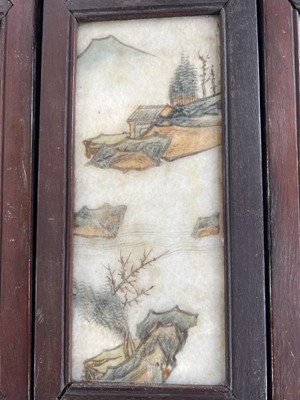 Lot 24 - A Chinese alabaster and hardwood seven paneled screen, Qing Dynasty, late 19th century.