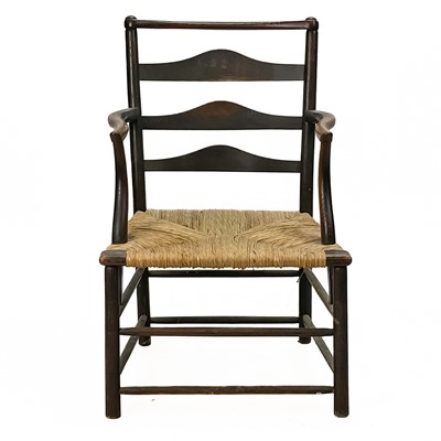 Lot 395 - An elm ladderback elbow chair.