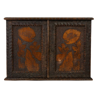 Lot 122 - A late Victorian pine poker work small wall cabinet.