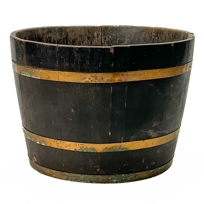 Lot 400 - A coopered oak and brass half barrel log bin.