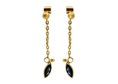 Lot 142 - A pair of contemporary, high purity gold blue sapphire set pendant stud earrings.