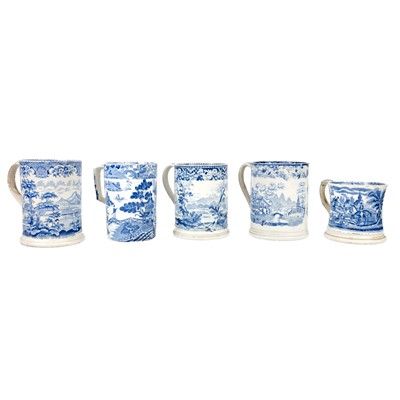 Lot 31 - Four blue and white printed porter mugs.