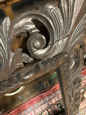 Lot 126 - A Continental carved oak frame.