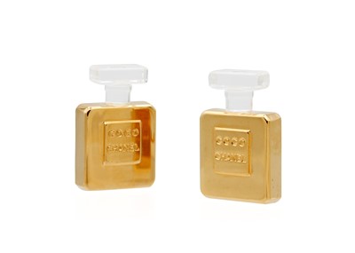 Lot 80 - A Chanel pair of 24ct gold-plated and clear celluloid Coco Chanel bottle earrings, circa 1970's.