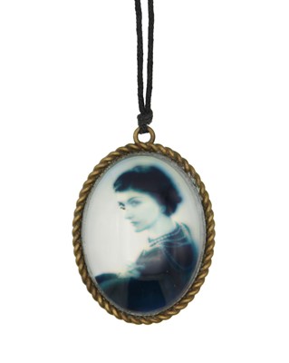 Lot 32 - A Chanel Runway oval photo pendant necklace with a photograph of Coco Chanel.