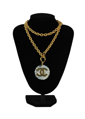 Lot 5 - A Chanel 24ct gold-plated CC and opalescent resin medallion necklace, circa 1990/91.