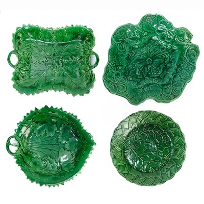 Lot 342 - A matched set of 19th century green glazed moulded earthen ware.