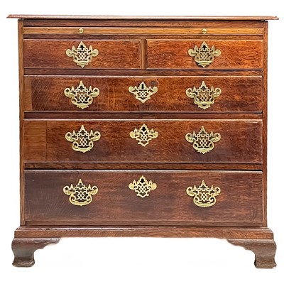 Lot 242 - A George III oak chest.