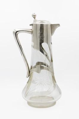 Lot 78 - An early 20th century Austrian Art Nouveau cut glass 800 silver mounted claret jug by Herman Suedfield.