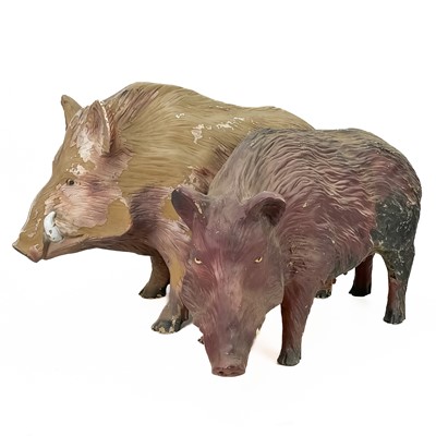 Lot 283 - A pair of large fibreglass figures of boars.