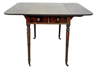 Lot 19 - A late George III figured mahogany and ebony strung Pembroke table.