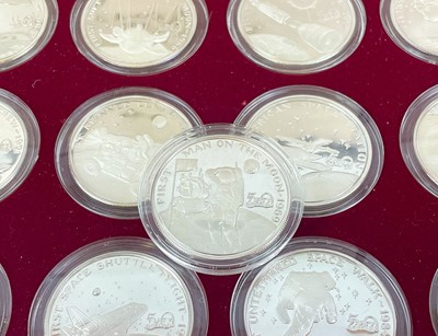 Lot 147 - "Milestones of Space Exploration" cased proof .999 silver crown sized 1 ounce $50 coins (x24)