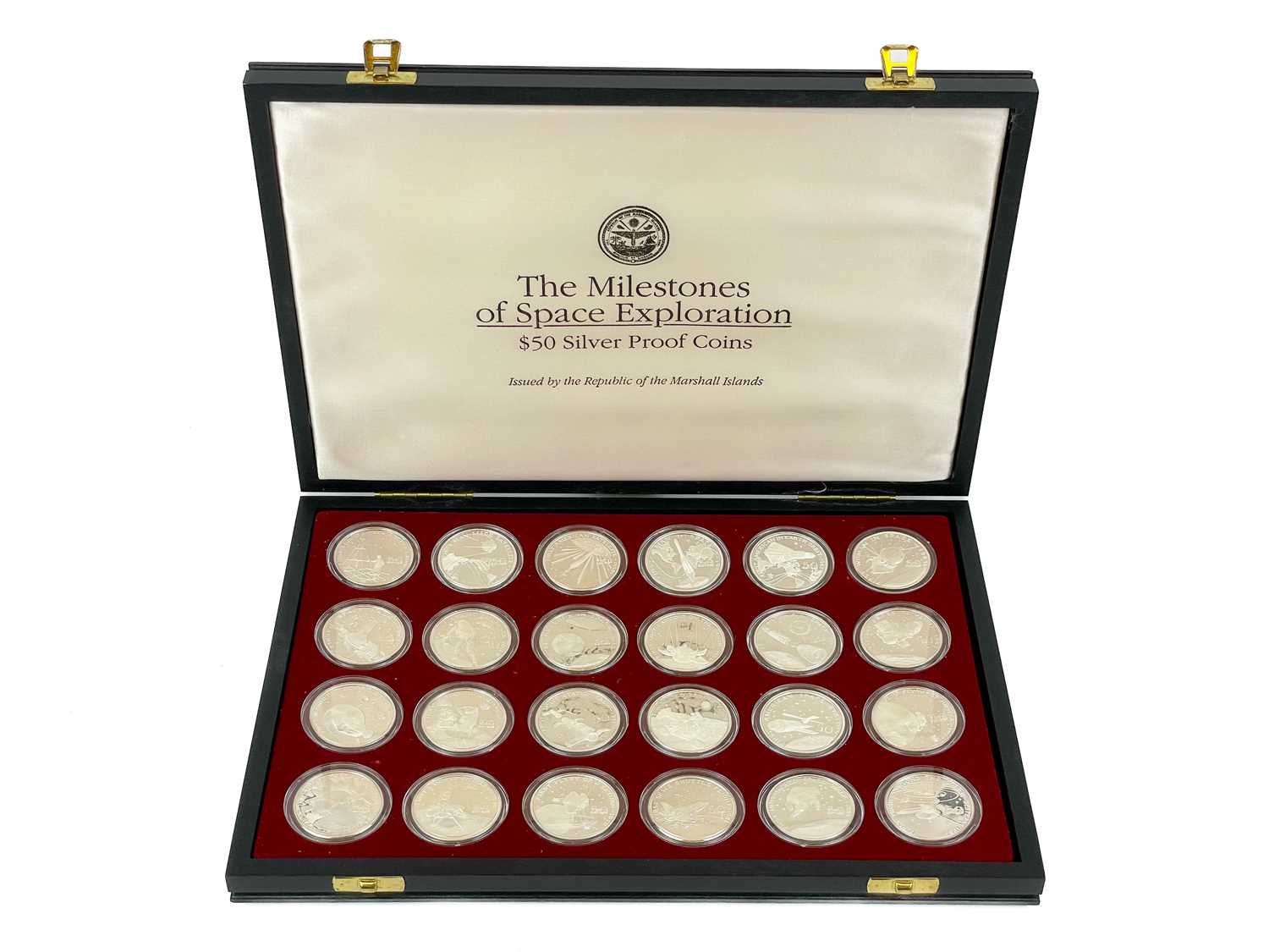 Lot 147 - "Milestones of Space Exploration" cased proof .999 silver crown sized 1 ounce $50 coins (x24)